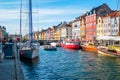 View of Nyhavn pier with color buildings, ships, yachts and other boats in the Old Town of Copenhagen, Denmark Royalty Free Stock Photo