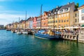 View of Nyhavn pier with color buildings, ships, yachts and other boats in the Old Town of Copenhagen, Denmark Royalty Free Stock Photo