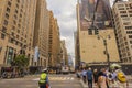 View of an NYPD police officer on Broadway in Manhattan, regulating traffic in front of a pedestrian crossing with people. Royalty Free Stock Photo