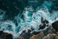 A View of the Ocean From Above of Rocks, Elevated view of ocean waves splashing against a rocky shoreline, AI Generated Royalty Free Stock Photo