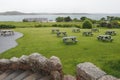 View of the ocean from the estate with benches on the grass on Isle of Iona, Scotland