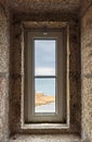 View of the ocean through a lighthouse window in the stone staircase Royalty Free Stock Photo