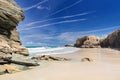 View of the ocean between rocks of Praia de Augas Santas.