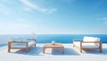 View of the ocean with wooden patio furniture and white couches