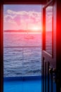 View on the ocean and yachts from open door of captain cabin Royalty Free Stock Photo