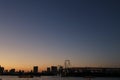 View from Odaiba Beach to Tokyo Bay with Rainbow Bridge at dusk