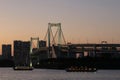 View from Odaiba Beach to Tokyo Bay with Rainbow Bridge at dusk