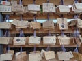 Wooden Ema Wish plaques hanging at Meiji-jingu Shrine, Tokyo, 2016 Royalty Free Stock Photo