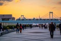 View at Odaiba west park bridge during sunset in the evening with rainbow bridge in the background Royalty Free Stock Photo