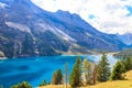 View of Oeschinen lake (Oeschinensee) and Swiss Alps near Kandersteg in Bernese Oberland, Switzerland