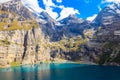 View of Oeschinen lake (Oeschinensee) and Swiss Alps near Kandersteg in Bernese Oberland, Switzerland