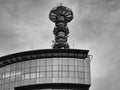 Glass office building with antenna at the top Royalty Free Stock Photo