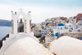 View Of Oia Over Church With Bells In Santorini island, Greece Royalty Free Stock Photo