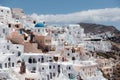 View of Oia town with church and blue dome in Santorini island in Greece. Summer vacation and holiday concept, luxury travel. Royalty Free Stock Photo