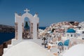 View of Oia town with church and blue dome in Santorini island, Greece. Royalty Free Stock Photo