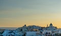 View of Oia town in Santorini with old white houses and windmill Royalty Free Stock Photo