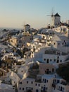 View of Oia Village with windmills at sunset, Santorin Greece