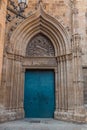 View of the old and beautiful art iron blue color door with door knocker, classic architectural detail in Barcelona Royalty Free Stock Photo