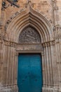 View of the old and beautiful art iron blue color door with door knocker, classic architectural detail in Barcelona Royalty Free Stock Photo