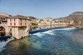 The old bridge and the old mill at the edge of the Tarn river in Millau - Aveyron - France Royalty Free Stock Photo