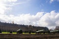 View of the old bronze cannons on the background of the Palace and the blue sky with clouds