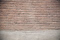 Old brown brick wall with rich colorful grainy texture and details Royalty Free Stock Photo