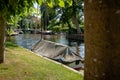 View of old canals with boats in an old Dutch town. Royalty Free Stock Photo