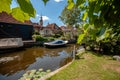 View of old canals with boats in an old Dutch town. Royalty Free Stock Photo