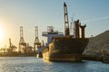 View of an old cargo vessel in a Commercial port. Royalty Free Stock Photo