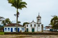 View of old church and houses in the street of colonial historical city in Brazil