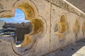 View of old city Dubrovnik through stone carved element of bridge in form of clover, Croatia