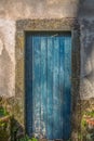 View of an old closed door in rustic wood painted blue Royalty Free Stock Photo