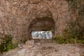 View through an old embrasure in an alpine fortress of the World War I, marking the former Austro-Italian frontier in the Dolomite