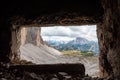 View through an old embrasure in an alpine fortress of the World War I, marking the former Austro-Italian frontier in the Dolomite