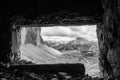 View through an old embrasure in an alpine fortress of the World War I, marking the former Austro-Italian frontier in the Dolomite