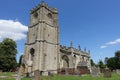 Old English church and grounds with a clear blue sky above