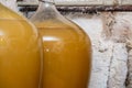 View of old fashioned wine cellar with glass storage for wine during fermentation process Royalty Free Stock Photo