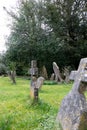 View of an old graves with green grass in the garden around St Andrew`s Church in Castle Combe Royalty Free Stock Photo