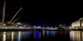 View of old harbor Porto Antico by night in Genoa, Italy.