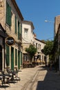 View of old, historical, traditional stone houses and cafes in famous, touristic Aegean town called Alacati.
