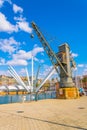 view of an old industrial crane with bigo observation deck at background in the port of genoa in Italy....IMAGE Royalty Free Stock Photo