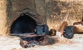 Old iron kettle on fireplace