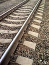 View of old iron rail road tracks. Rail road tracks leading into the distance Royalty Free Stock Photo