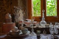 View of old kitchenware next to a window inside a Catalan farmhouse Royalty Free Stock Photo