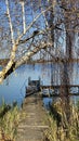 View of the old lake pier on a sunny blue sky day Royalty Free Stock Photo