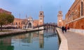 Venice. Old stone towers of the arsenal over the canal on a gloomy day. Royalty Free Stock Photo