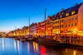 View of the old Nyhavn canal of Copenhagen in the evening sunset