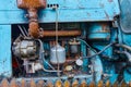 View of an old oiled and rusted tractor engine, background Royalty Free Stock Photo