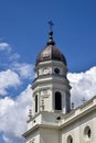 View of old Orthodox white church with grey domes in monastery against background cloudy sky. Concept of Religion Royalty Free Stock Photo