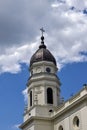 View of old Orthodox white church with grey domes in monastery against background cloudy sky. Concept of Religion Royalty Free Stock Photo